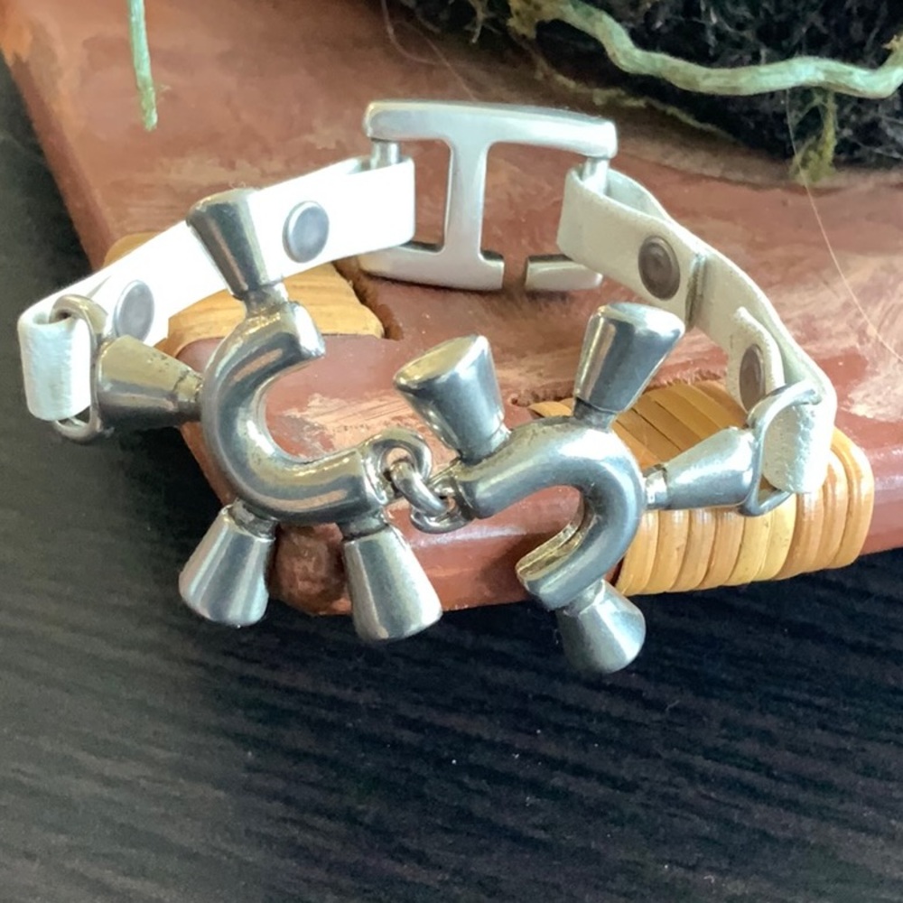 Leather and silver tone bracelet